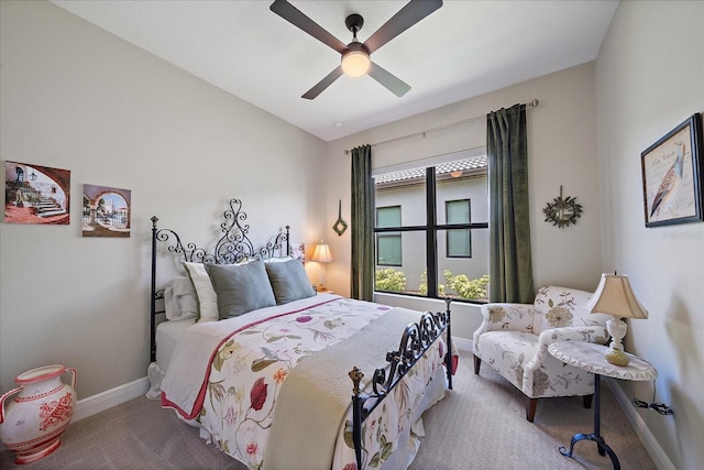 bedroom featuring ceiling fan, carpet flooring, and vaulted ceiling