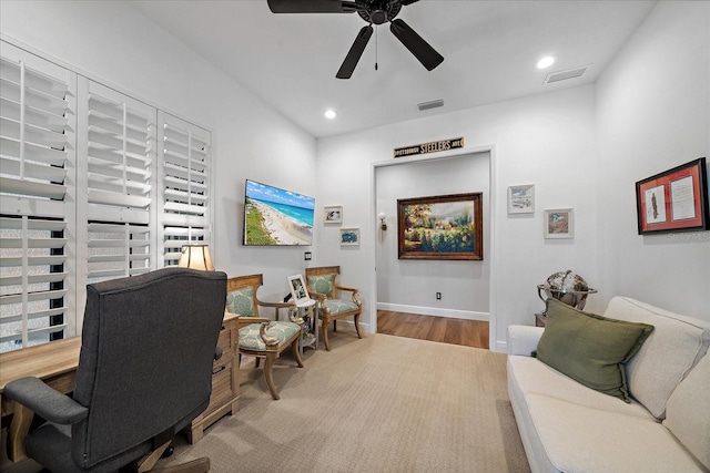 office space featuring ceiling fan and light wood-type flooring