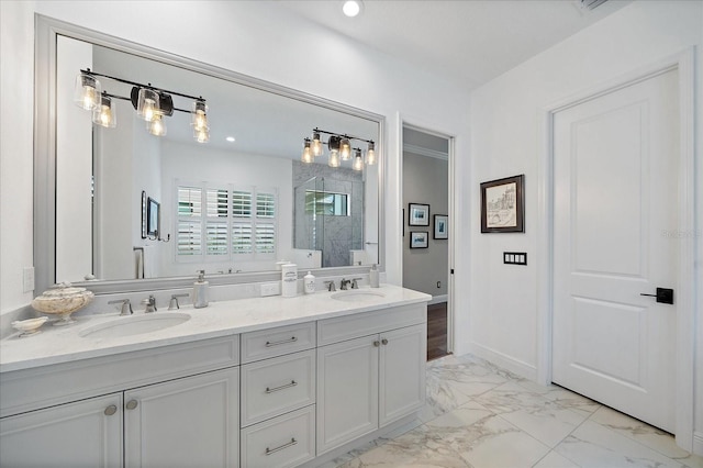 bathroom featuring vanity and a shower with shower door