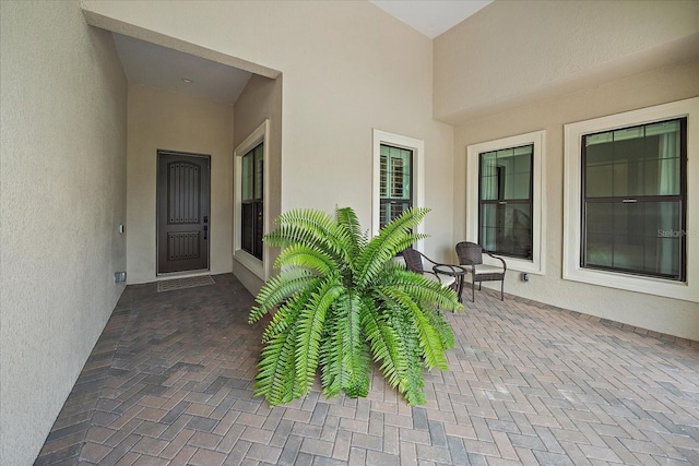 property entrance featuring a patio area