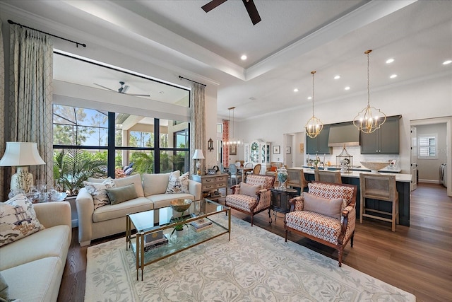 284 Bocelli Dr, Nokomis, FL 34275 - living area with ceiling fan, a chandelier, ornamental molding, wood finished floors, and recessed lighting