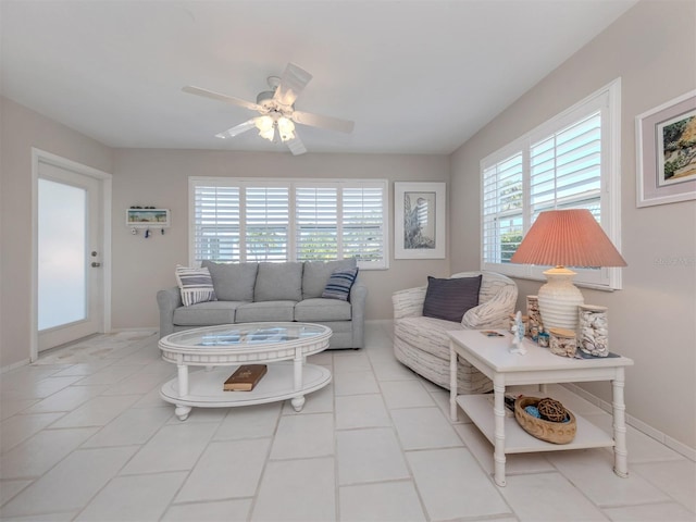 tiled living room with ceiling fan