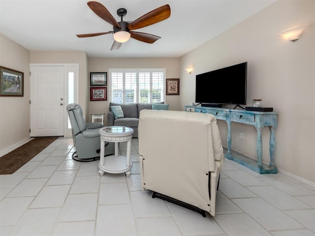 tiled living room with ceiling fan