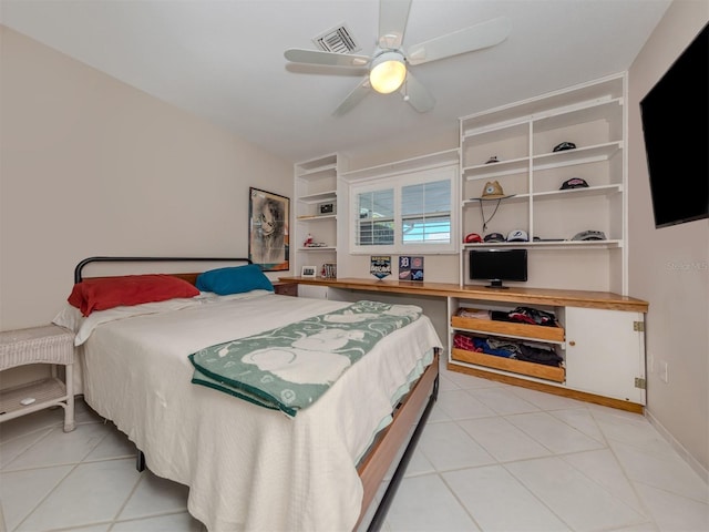 bedroom with ceiling fan and light tile patterned floors