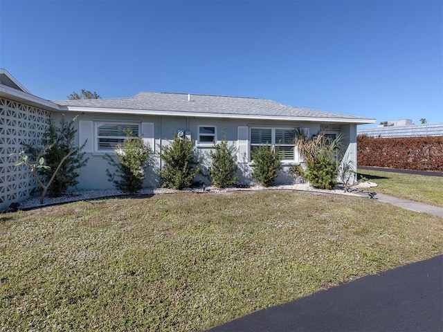 view of front of property with a front lawn