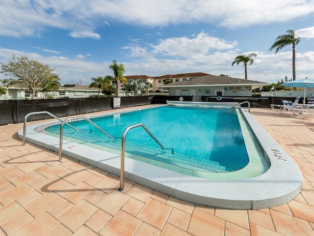 view of swimming pool featuring a patio area