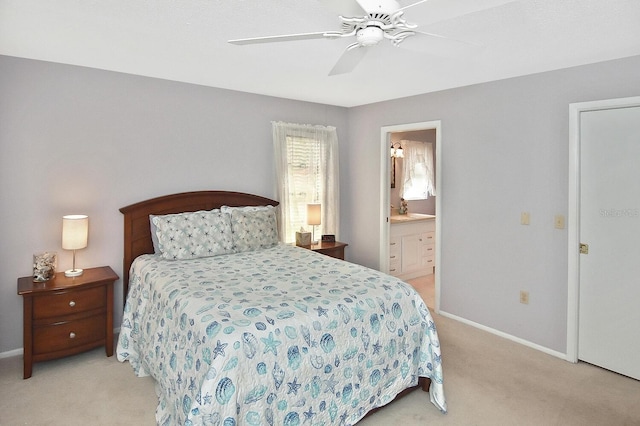 carpeted bedroom with connected bathroom and ceiling fan