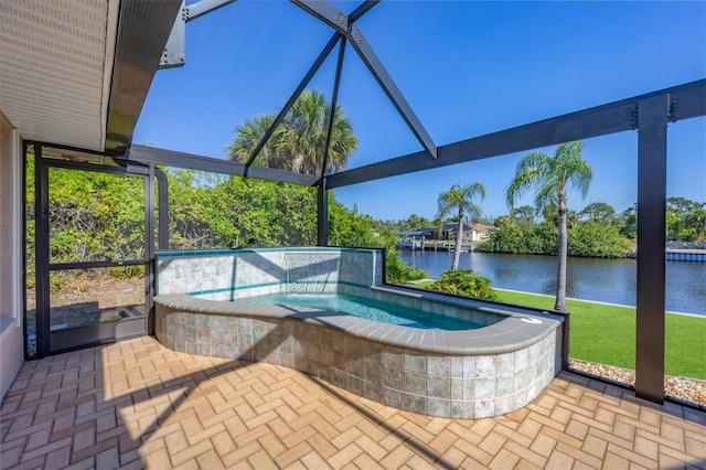 view of pool featuring a patio area, a lanai, a water view, and a hot tub