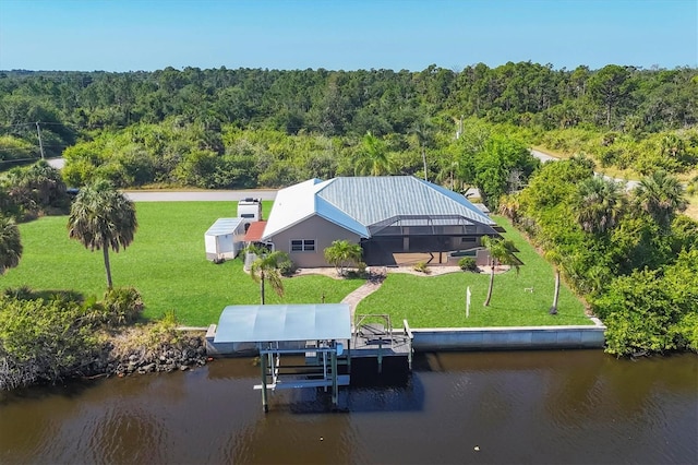 aerial view with a water view and a forest view