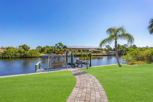 dock area featuring a water view and a yard