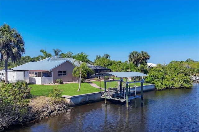 view of dock featuring a water view, a lanai, and a yard