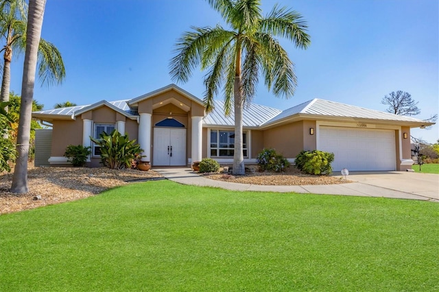 ranch-style house featuring a garage and a front lawn