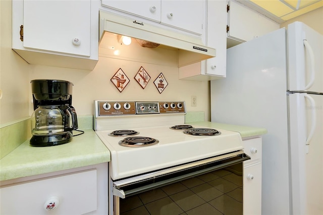 kitchen featuring white electric range oven, tile flooring, and white cabinetry