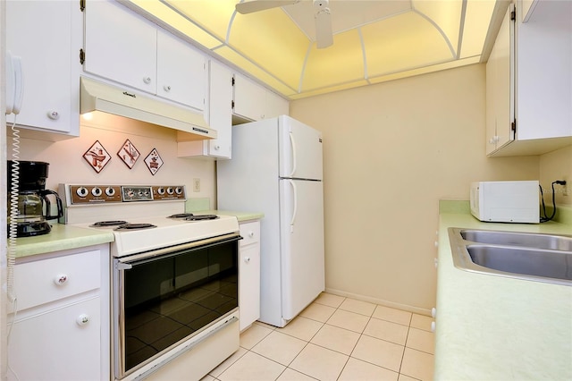 kitchen featuring white appliances, white cabinetry, and light tile floors