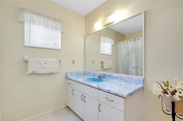 bathroom with tile flooring and vanity