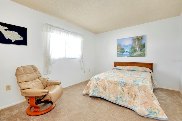 carpeted bedroom featuring a textured ceiling