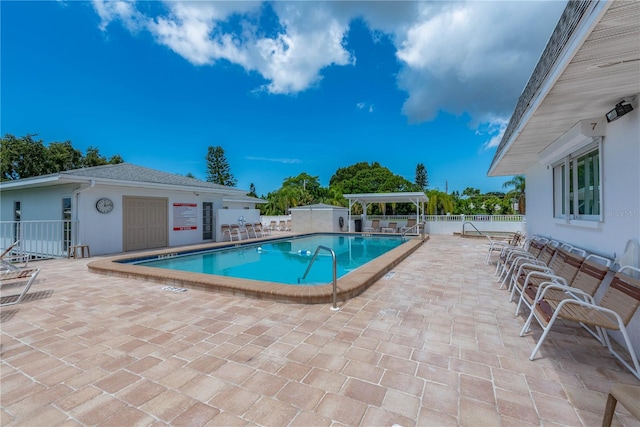 view of swimming pool featuring a patio