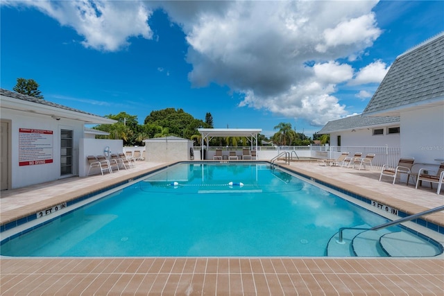 view of swimming pool with a patio area