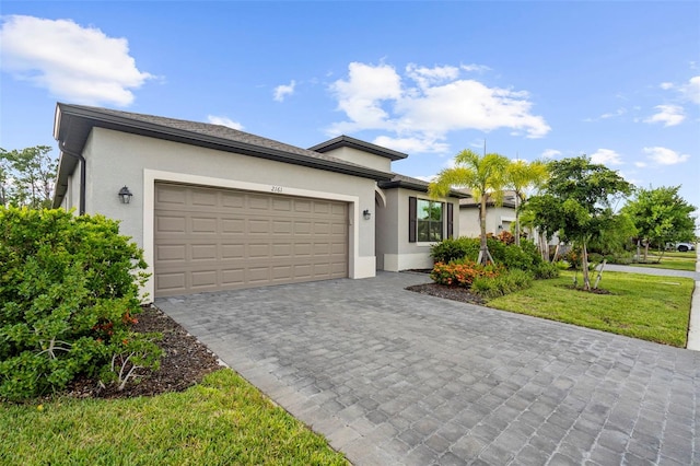 view of front of home featuring a garage and a front yard