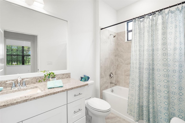 full bathroom featuring vanity, toilet, and shower / tub combo with curtain