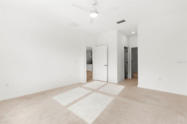 unfurnished bedroom featuring ceiling fan and light carpet