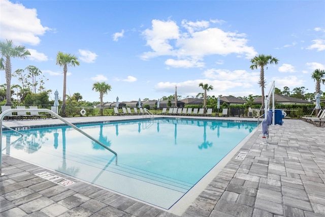 view of swimming pool featuring a patio area