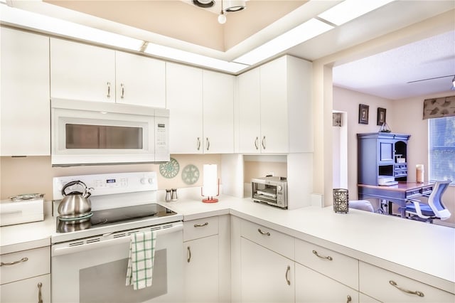 kitchen with white cabinets and white appliances