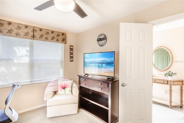 living area with ceiling fan