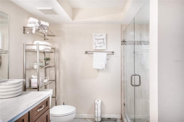 bathroom with tile patterned flooring, vanity, toilet, and an enclosed shower