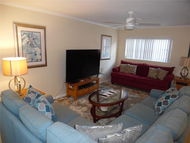 living room featuring carpet, ceiling fan, and ornamental molding