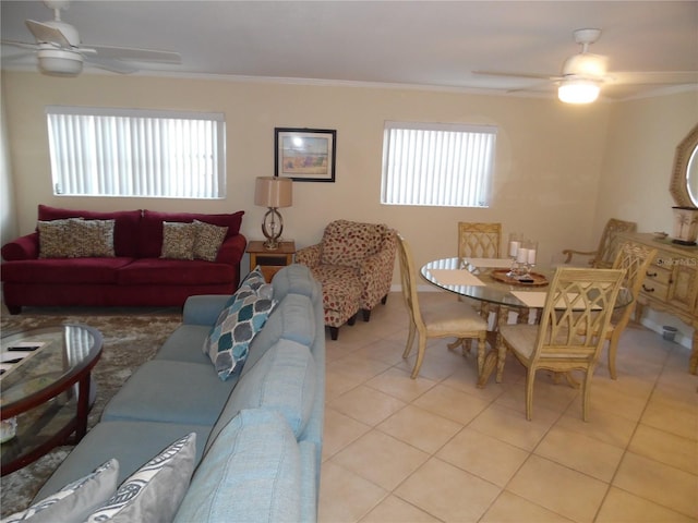 living room featuring crown molding, plenty of natural light, and light tile patterned flooring