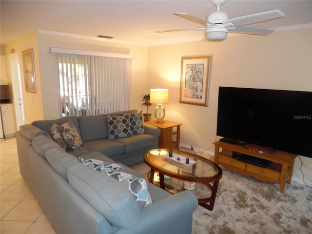 tiled living room with ceiling fan and ornamental molding