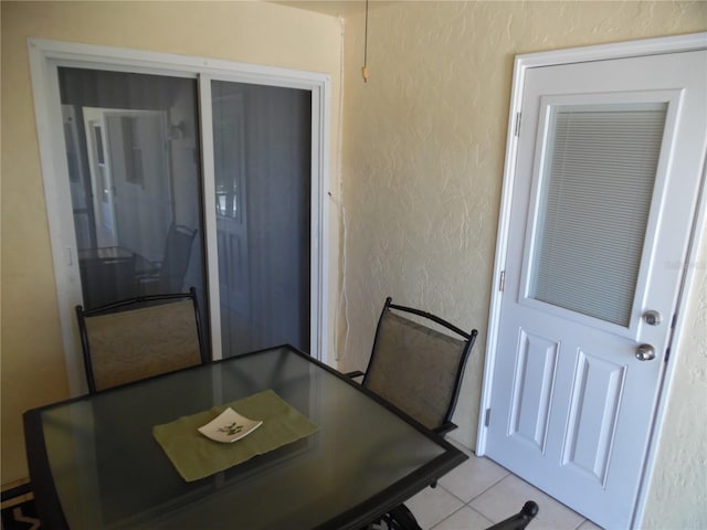 dining space with light tile patterned floors