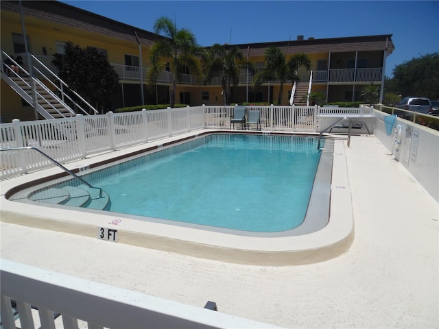 view of pool featuring a patio