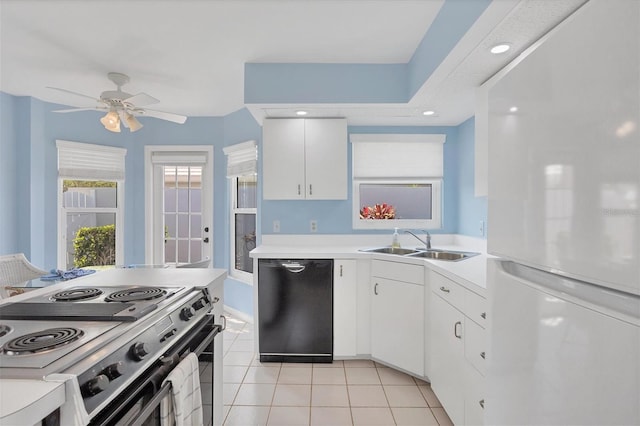 kitchen with dishwasher, white cabinets, white refrigerator, sink, and stainless steel electric range oven