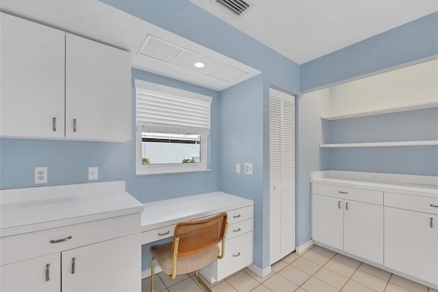 office with light tile patterned floors