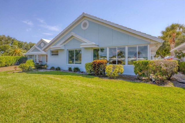 view of home's exterior with a yard