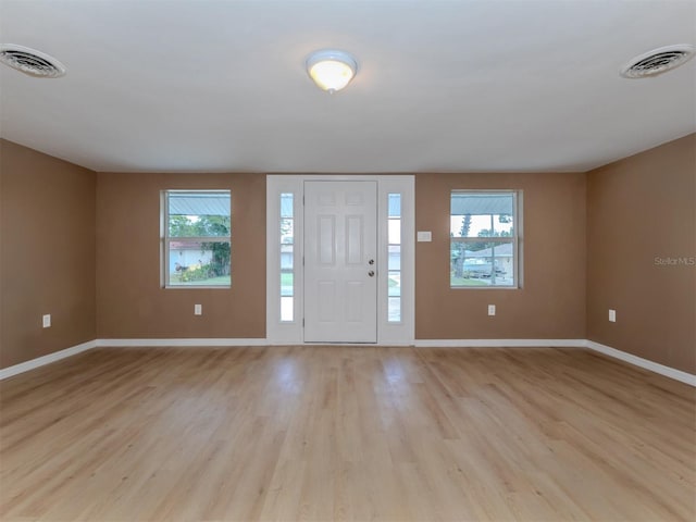 entryway with light hardwood / wood-style floors