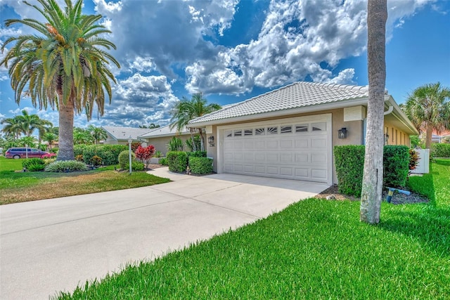 view of front of home with a garage and a front yard