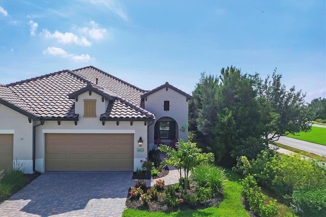 mediterranean / spanish-style home featuring a garage