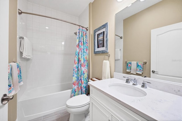 full bathroom featuring toilet, shower / bath combination with curtain, and vanity