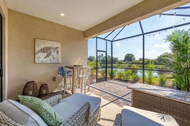 sunroom with a water view