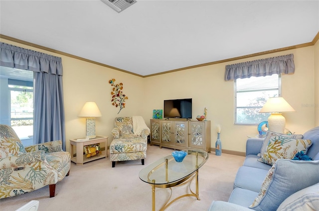 carpeted living room featuring a healthy amount of sunlight and ornamental molding