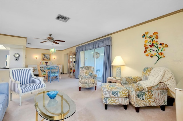 carpeted living room with ceiling fan and crown molding