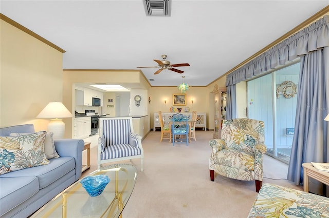 living room with ornamental molding, light colored carpet, and ceiling fan