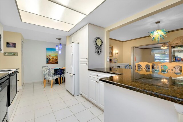 kitchen with ceiling fan, white fridge, light tile flooring, pendant lighting, and white cabinetry