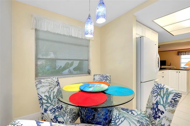 dining room featuring light tile patterned flooring