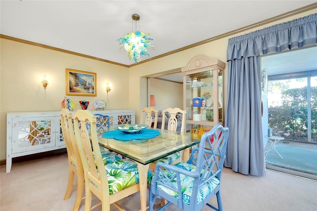 dining area with carpet flooring, a chandelier, and crown molding