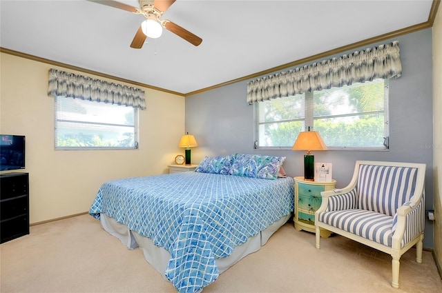 bedroom with crown molding, ceiling fan, carpet flooring, and multiple windows