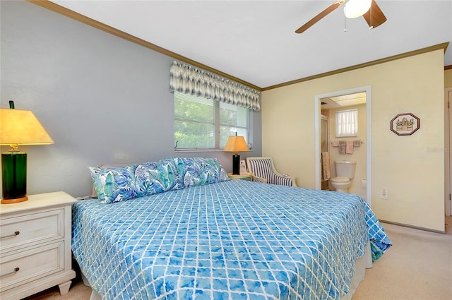 carpeted bedroom with crown molding, ceiling fan, and connected bathroom